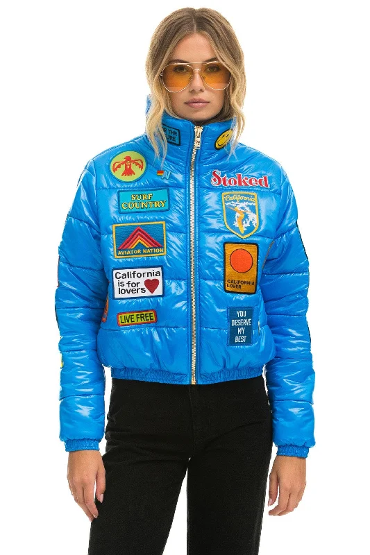 Women's Evening Wear Outfit VINTAGE PATCH APRES PUFFER JACKET - BLUE CINA GLOSSY